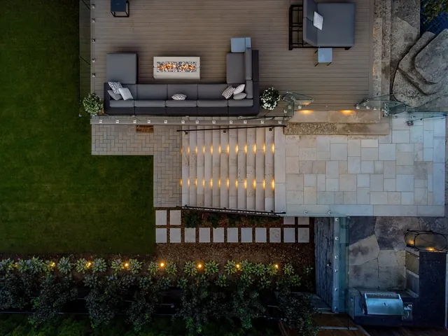 Top-down aerial of a rooftop lounge and stairs