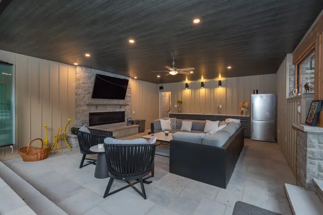 Covered pavilion lounge with TV and fireplace