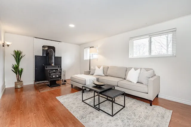 Lower-level rec room with wood stove