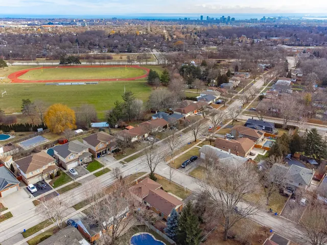 Aerial of a suburb with the city skyline in the distance
