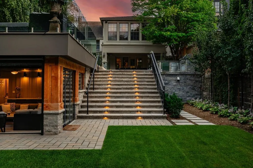 Lit pavilion stairs at twilight